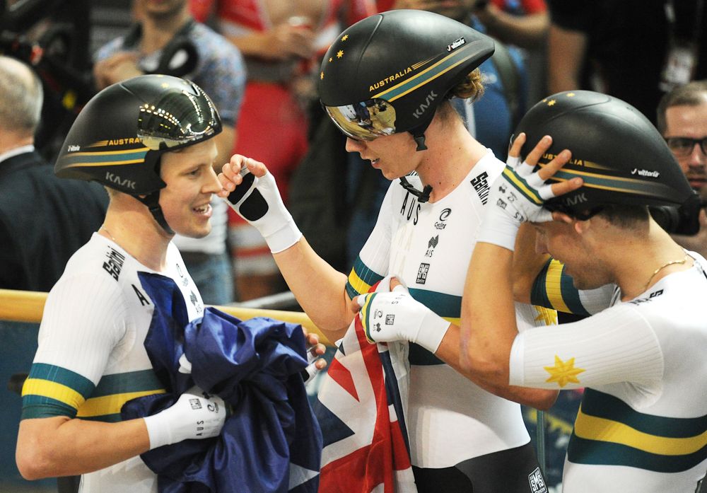 Australia's Alexander Porter (L) Kellard O'Brien (C) and Samuel Welsford celebrate after breaking the team persuit world record during the UCI Track Cycling World Championships