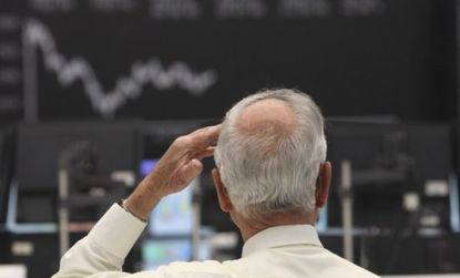 A German trader watches the Frankfurt Stock Exchange whose parent company Deutsche Boerse is rumored to be in talks to buy the NYSE.