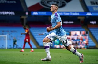 Phil Foden celebrates scoring Manchester City's third