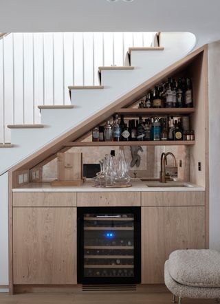 Home bar built under stairs