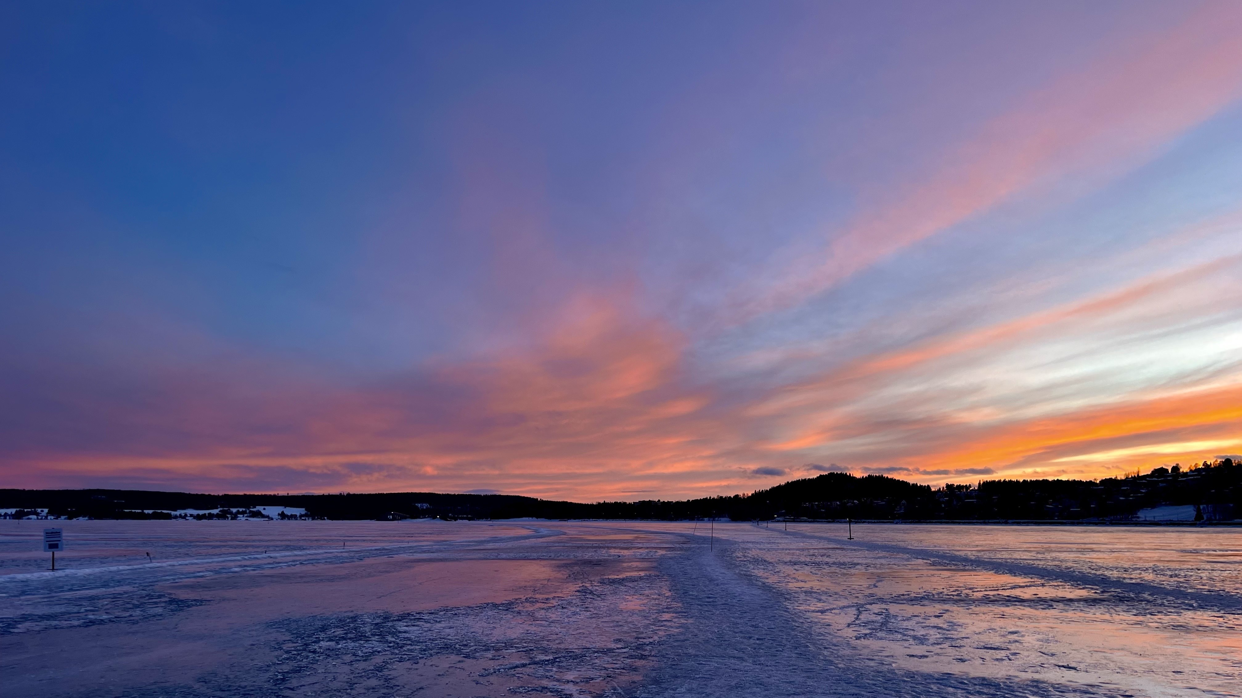 vibrant orange, pink and lilac sky