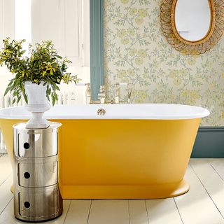 Wallpaper on wall with mirror and bathtub