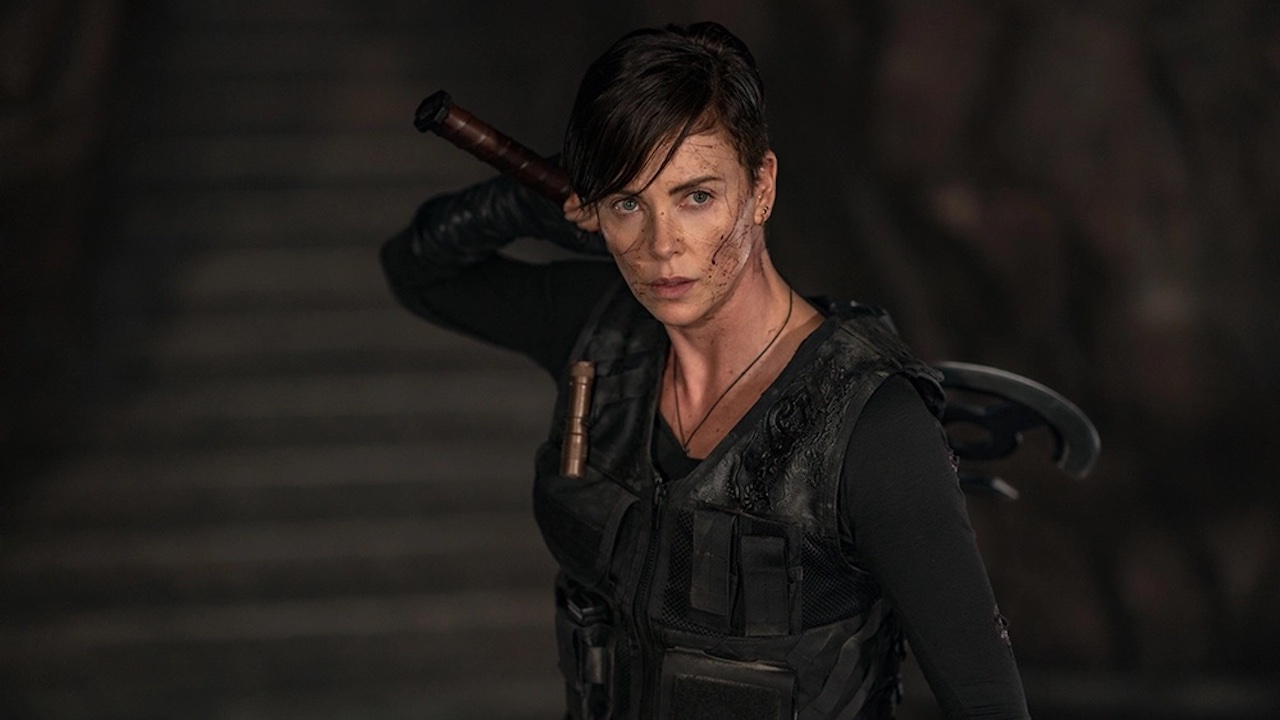 Charlize Theron, Andy wielding an ax in Netflix's The Old Guard