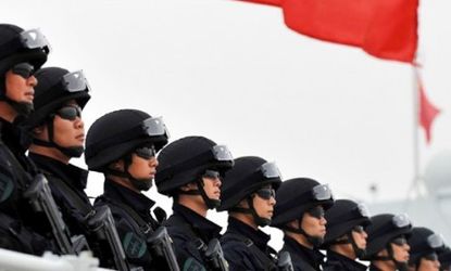 Chinese soldiers on a warship in November 2010: The communist country's "relentless" military buildup should not be taken lightly, says Aaron L. Friedberg in The New York Times.