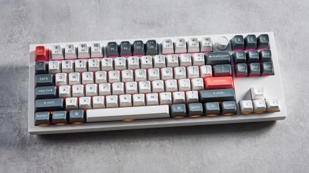 Keychron Q3 Ultra 8K photographed on a grey table in front of a blue background