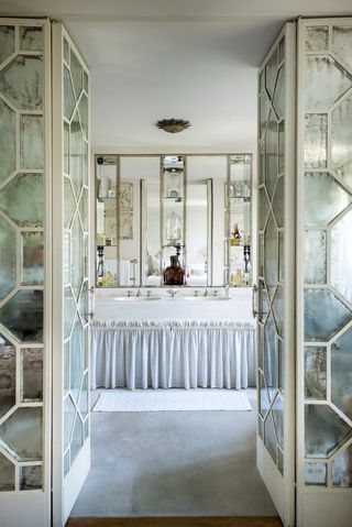bathroom storage with mirrored doors