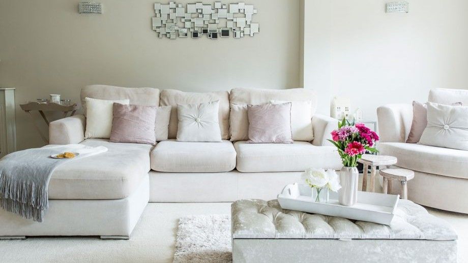 living room with white walls and white sofa