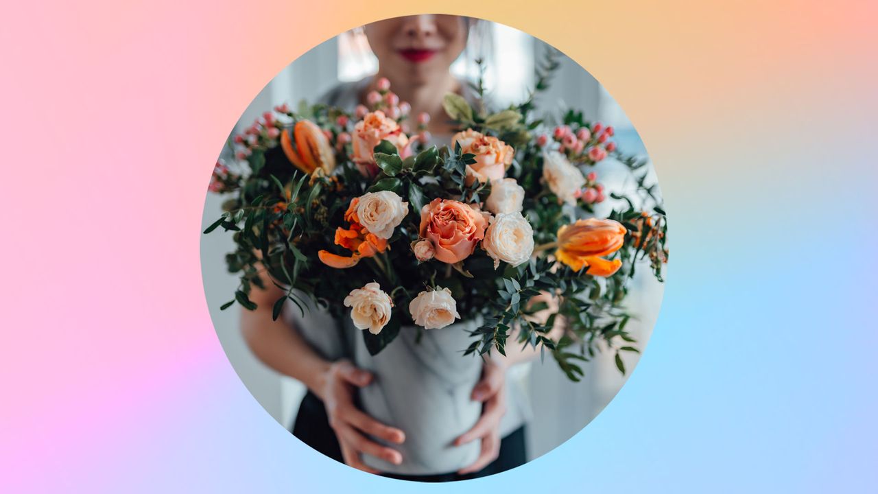 Shot of an unrecognisable woman covering her face with flowers in living room