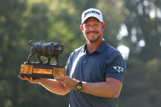 Jacques Kruyswijk holds the Kenya Open trophy