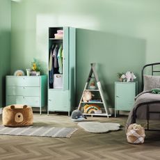 Kids bedroom with green chest of drawers and wardrobe