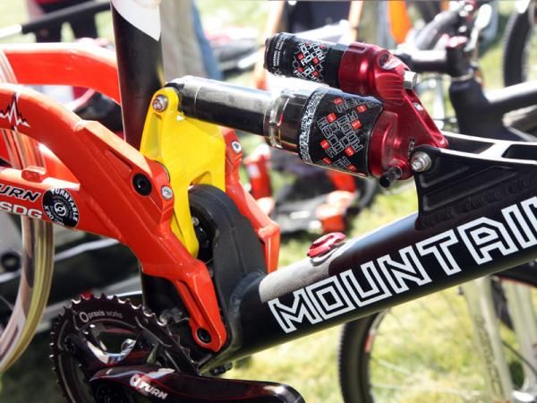 Mountain Cycle says the eccentric link pivot allows the shock to travel in a linear fashion as the rear swingarm moves through its arc.