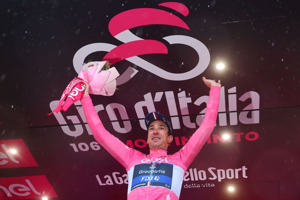 New overall leader Groupama FDJs French rider Bruno Armirail celebrates his pink jersey on the podium after the fourteenth stage of the Giro dItalia 2023 cycling race 193 km between Sierre and Cassano Magnago on May 20 2023 Photo by Luca Bettini AFP Photo by LUCA BETTINIAFP via Getty Images