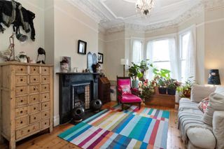 Before photos of the front room in a renovated period property living room in South West London