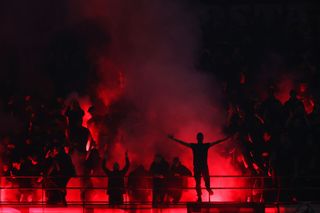 A general view as fans of AC Milan use Smoke Flares during the UEFA Champions League semi-final first leg match between AC Milan and FC Internazionale at San Siro on May 10, 2023 in Milan, Italy.
