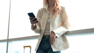 woman at airport with jacket on