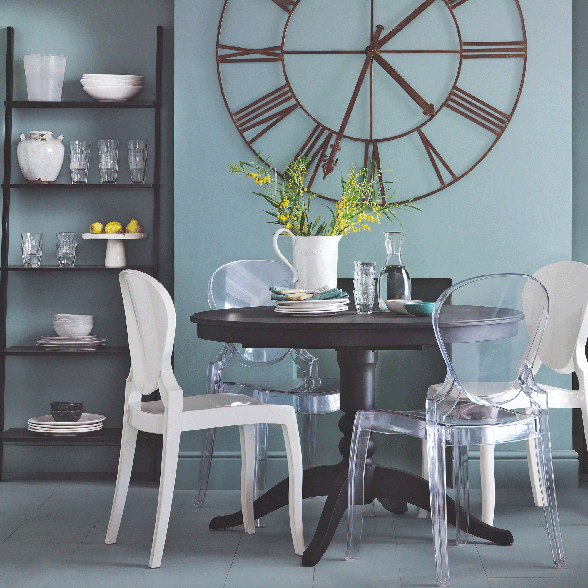 Blue dining room with clock wall decor