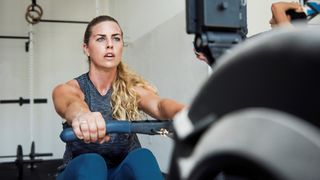 a girl on a rowing machine 