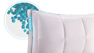 The Simba Hybrid Pillow surrounded by blue memory foam cube filling