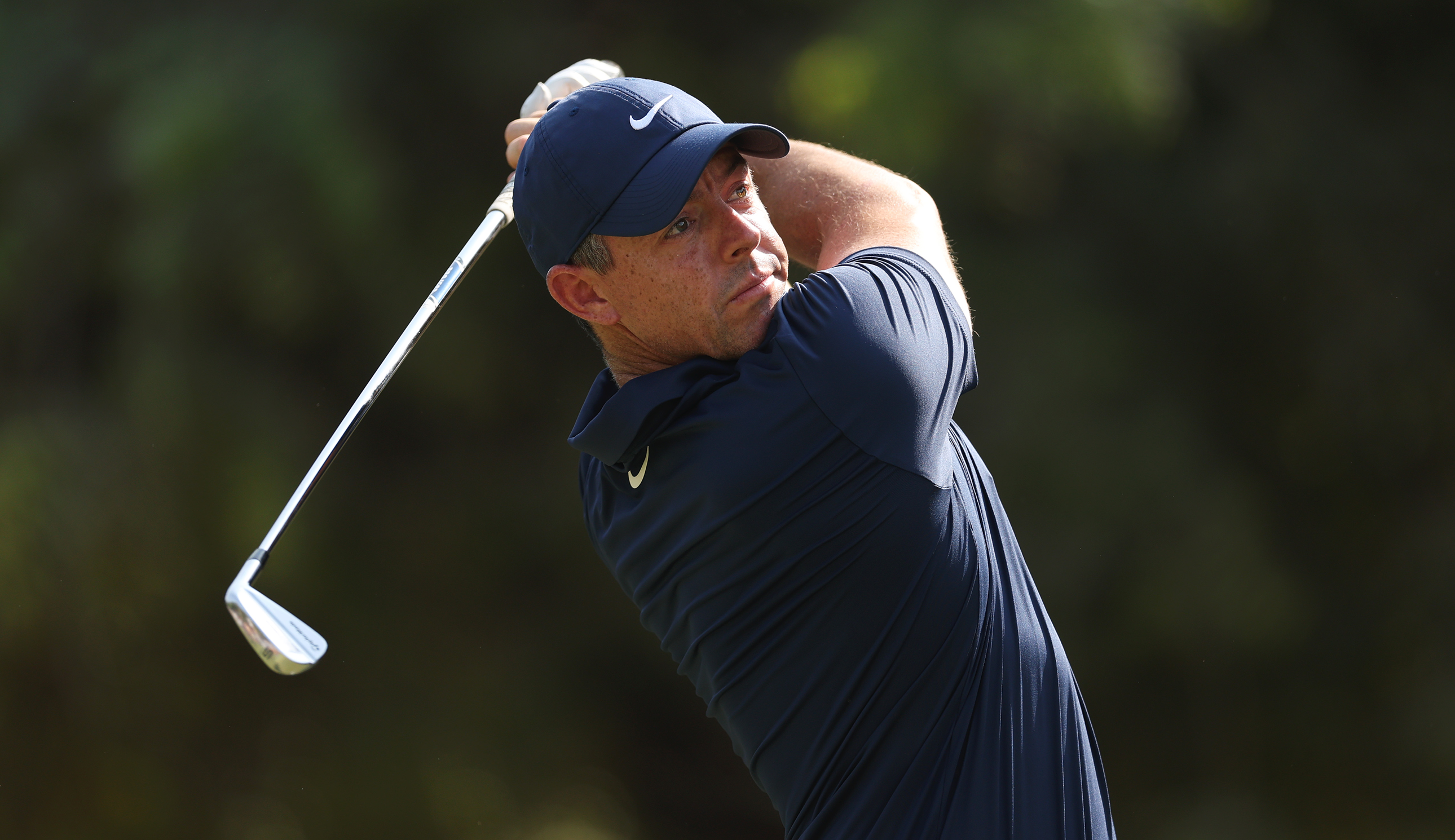 Rory McIlroy hits an iron shot