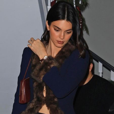 Kendall Jenner attended a holiday party in the stirrup leggings trend, and a Valentino fur-trimmed coat from Jennifer Lawrence's closet