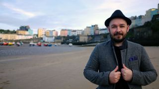 Photo of man standing in a harbour