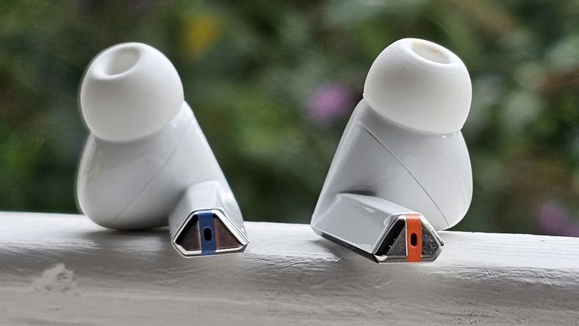 The Samsung Galaxy Buds 3 Pro against a leafy background.