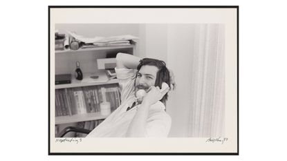 Steve Jobs on the phone (photo by Bill Kelley). Caption in book reads: Apple outgrew its headquarters twice in 1977