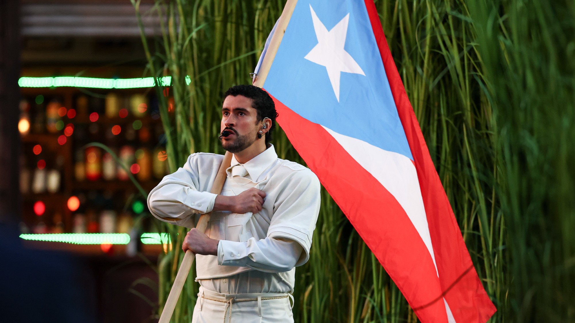 Bad Bunny holding a Puerto Rican flag during the 2026 Super Bowl halftime show