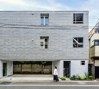 hero exterior with residents walking outside at FLAT369 in Japan