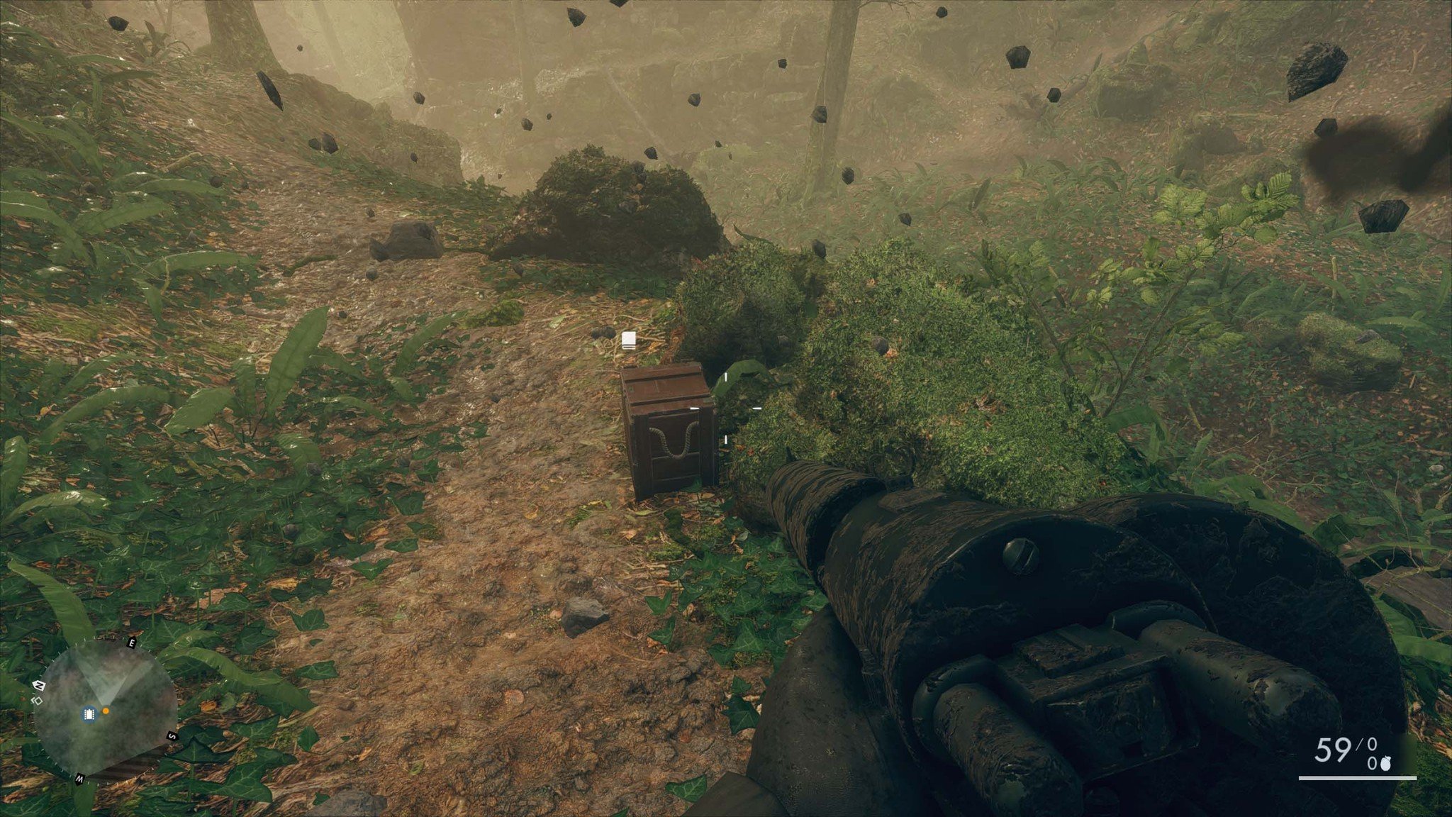 The field manual is located beneath the bridge behind a small set of rocks.