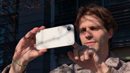 A man holding the iPhone Air in landscape