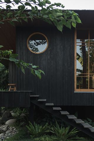 tsuki, a house by colvin haven in bali, set within green nature and made with wood and natural materials