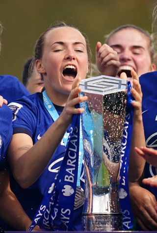 Magda Eriksson celebrates with the WSL trophy on Sunday