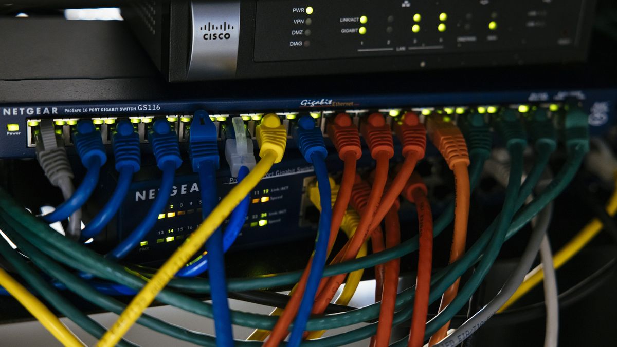 Ethernet cables plugged into a router at a quantum computing lab at the University of Chicago&#039;s Eckhardt Research Center in Chicago, Illinois, US, on Wednesday, Oct. 19, 2022. There is no cellular signal or wi-fi in the basement lab. Photographer: Taylor Glascock/Bloomberg via Getty Images