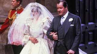 LONDON, ENGLAND - JULY 29: Lady Diana Spencer, wearing a wedding dress designed by David and Elizabeth Emanuel and the Spencer family Tiara, enters St. Paul's Cathedral on the hand of her father, Earl Spencer, ahead of her marriage to Prince Charles, Prince of Wales on July 29, 1981 in London, England.