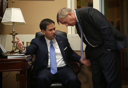 Sens. Marco Rubio and Linsdey Graham huddle in 2014