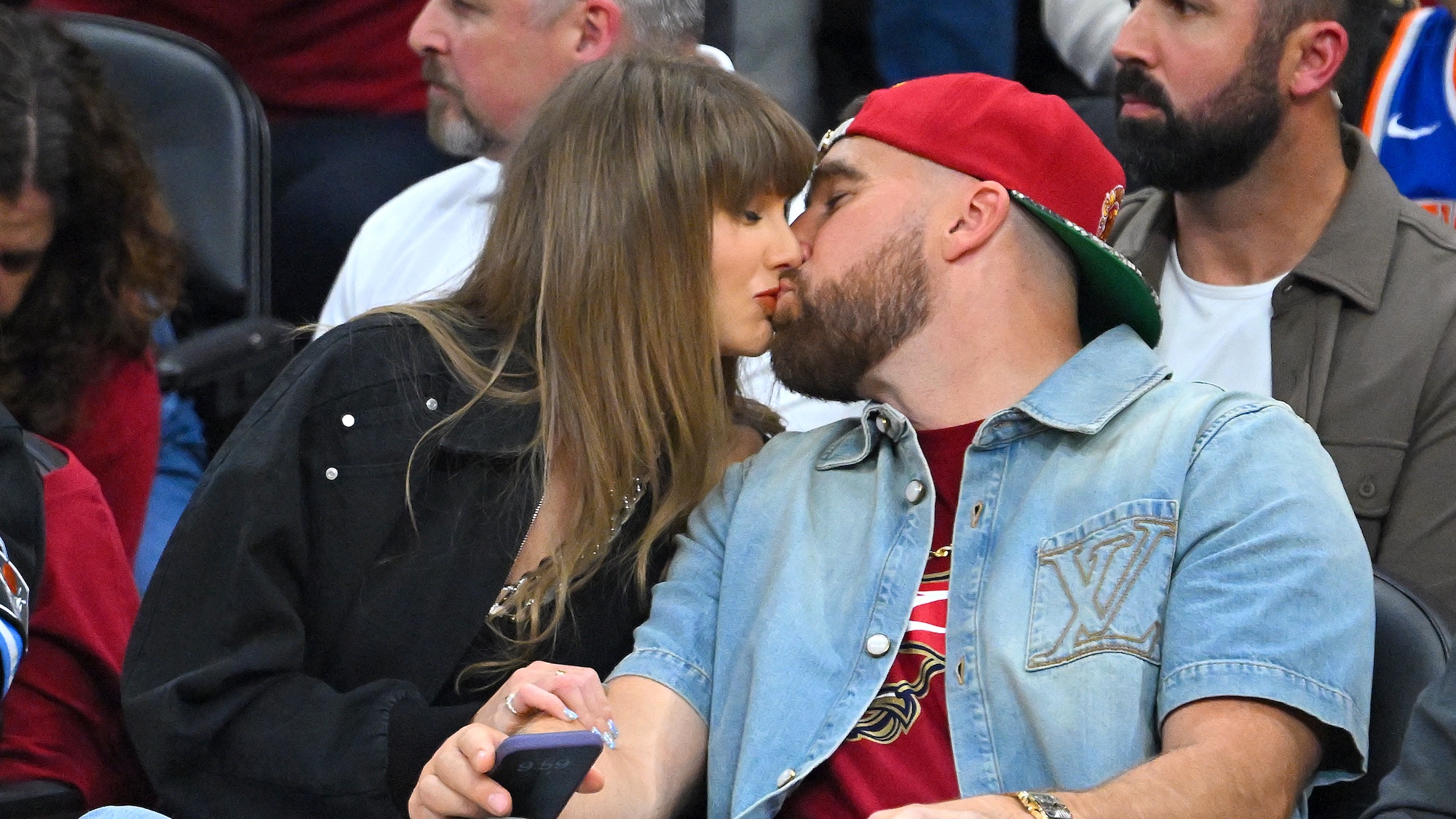 Kelce and Swift kissing at an NBA game in 2026