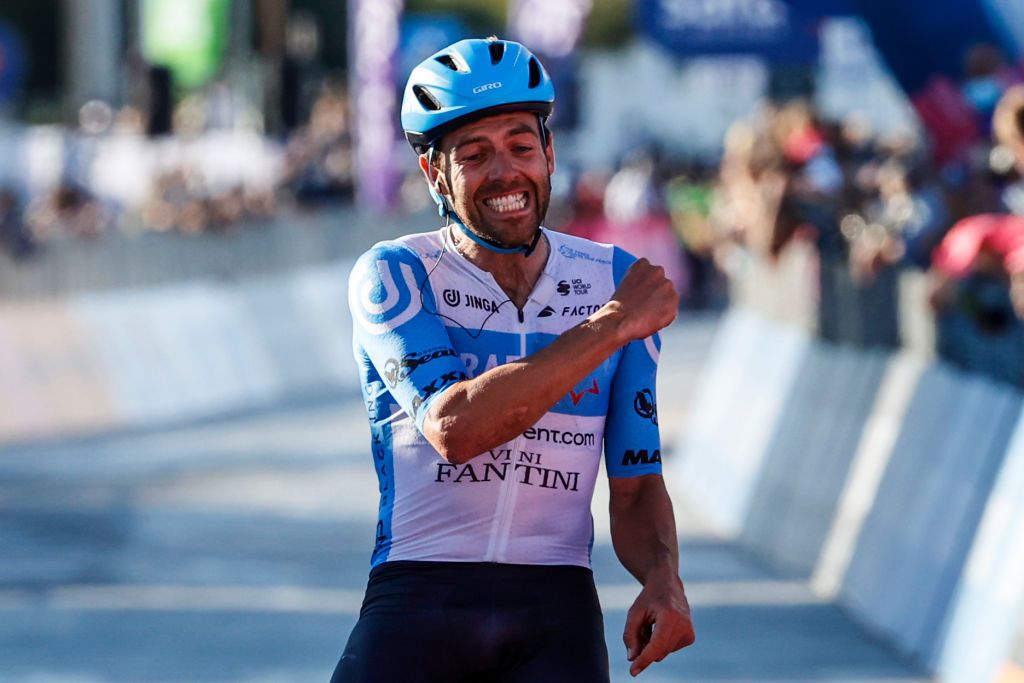 Team Israel StartUp Nation rider Englands Alex Dowsett celebrates as he crosses the line for victory during the 8th stage of the Giro dItalia 2020 cycling race a 200kilometer route between Giovinazzo and Vieste on October 10 2020 Photo by Luca Bettini AFP Photo by LUCA BETTINIAFP via Getty Images