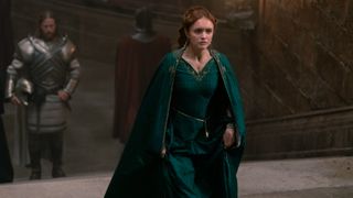Alicent Hightower (Olivia Cooke) at court in a long green gown in House of the Dragon.