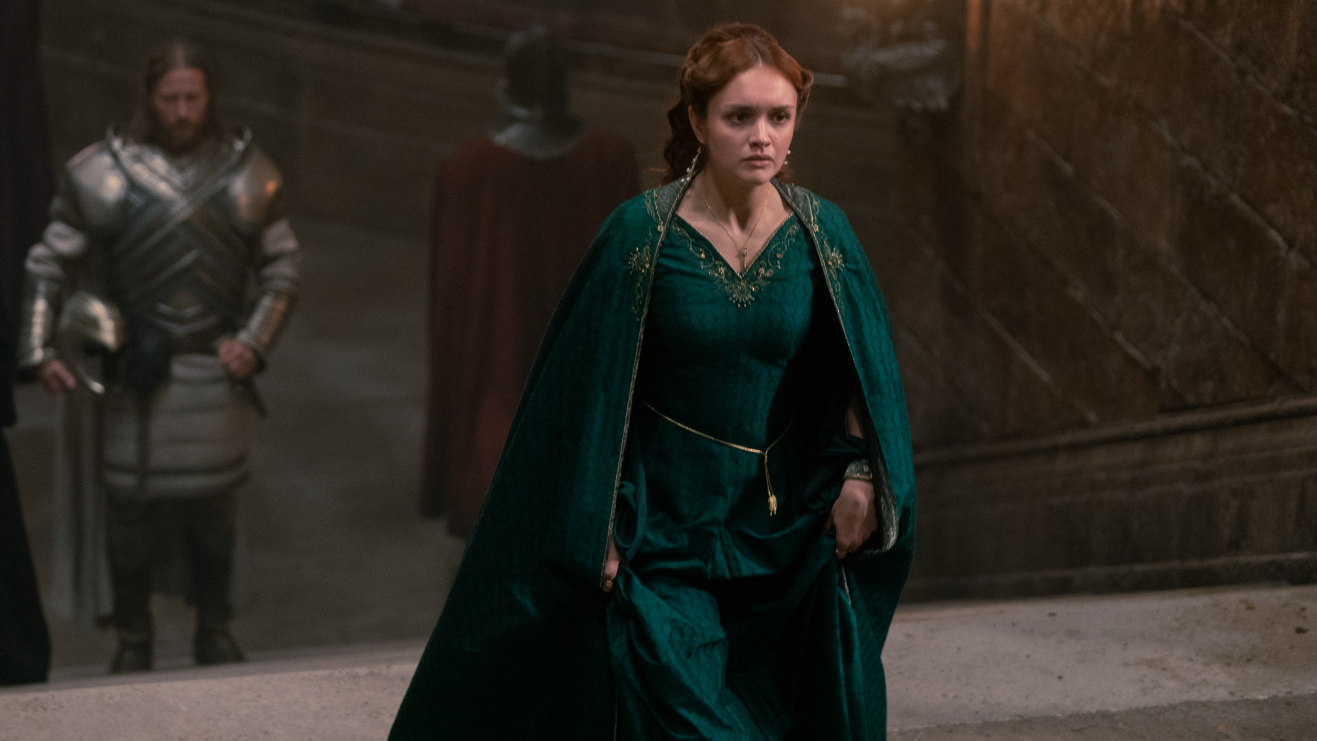 Alicent Hightower (Olivia Cooke) at court in a long green gown in House of the Dragon.