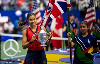 Emma Raducanu of Great Britain celebrates with the US Open winner's trophy after her victory over Leylah Fernandez