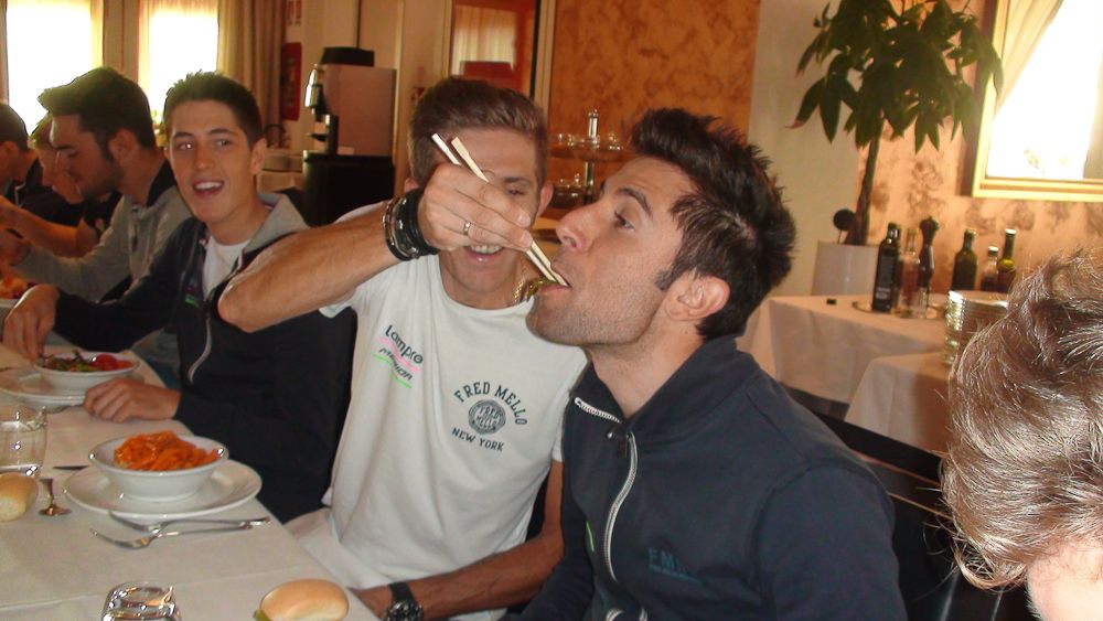 Przemyslaw Niemiec feeds Diego Ulissi at the Project TJ Sport camp