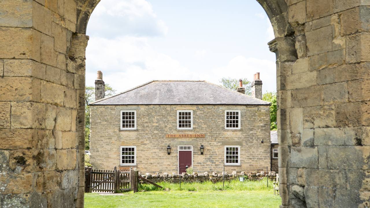 An exterior shot of the Abbey Inn taken from the abbey opposite