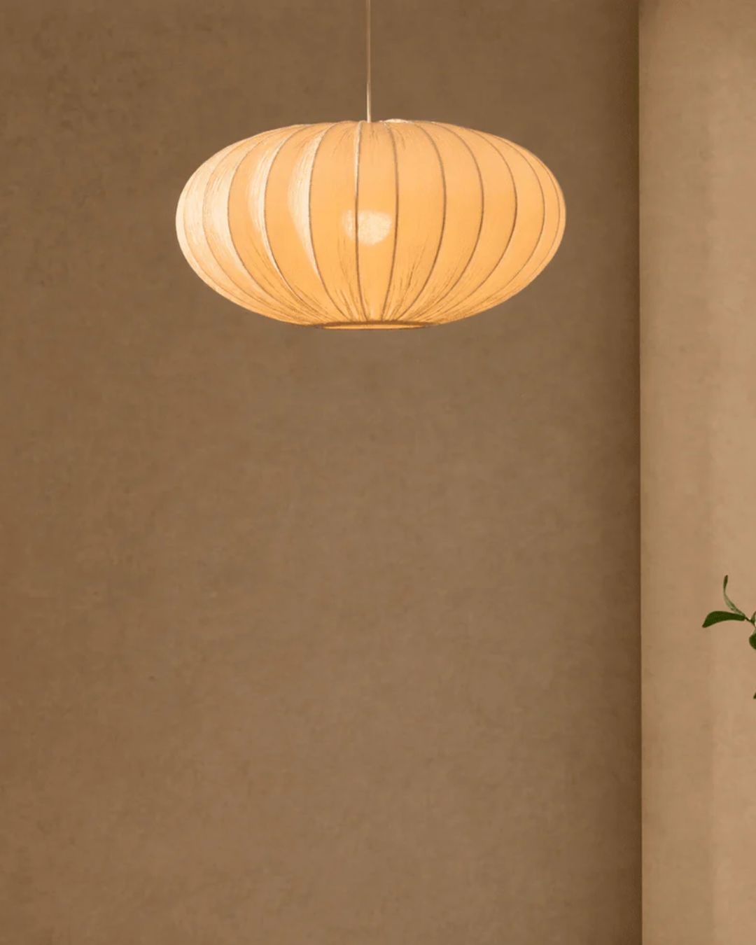 Akari Origami Easy-Fit Ceiling Light Shade in White installed in a beige-painted, warm living room.