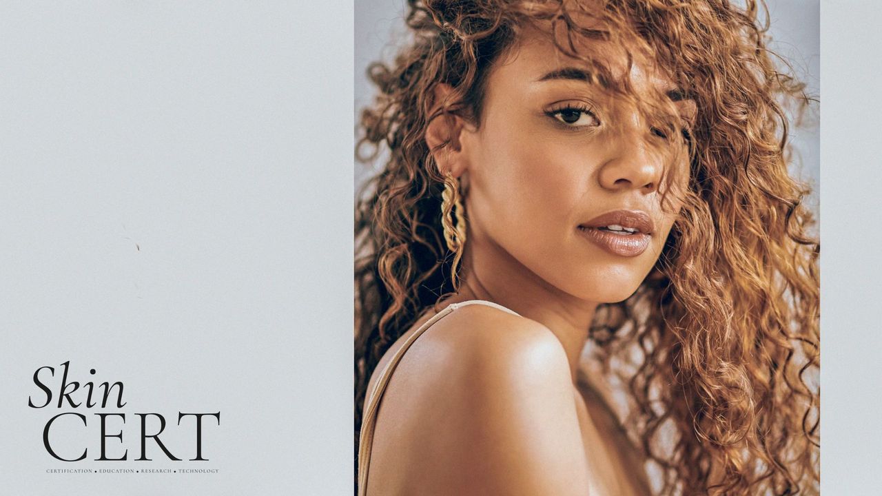 Portrait of a woman with curly hair natural-looking make-up 