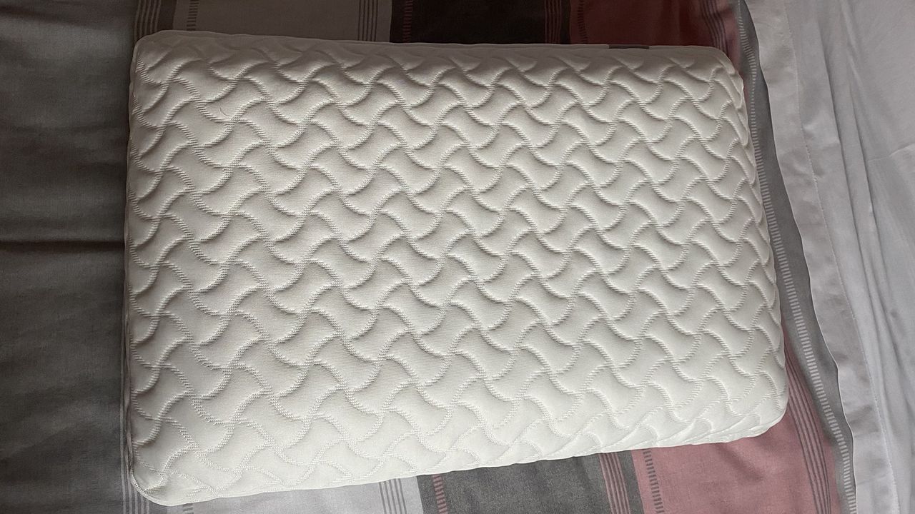 The Tempur-Pedic Tempur-Cloud pillow after unpacking, on a bed in the reviewer's home