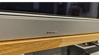 Bose Smart Ultra Soundbar beneath a TV