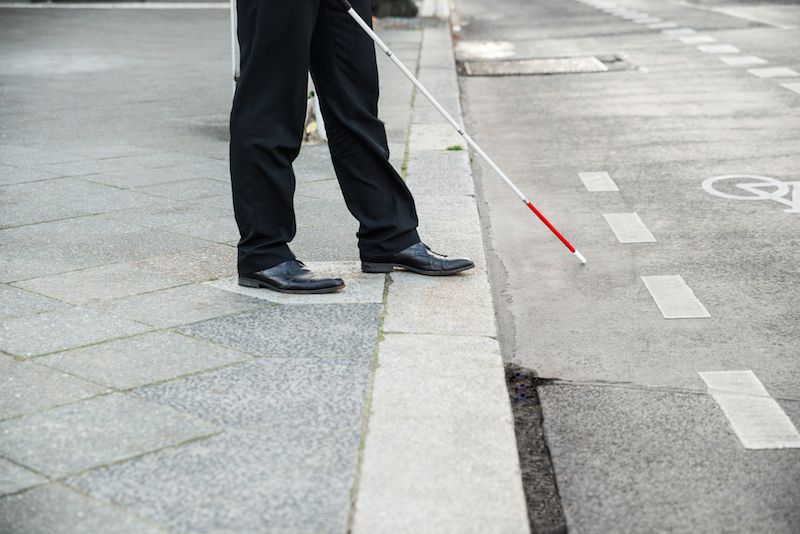 blind person with cane