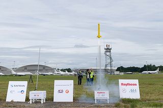 : Liftoff! The Space Potatoes rocket takes flight at the Farnborough International Airshow. The Bellvue, Washington, team took first place at the 2016 International Rocketry Challenge July 15.