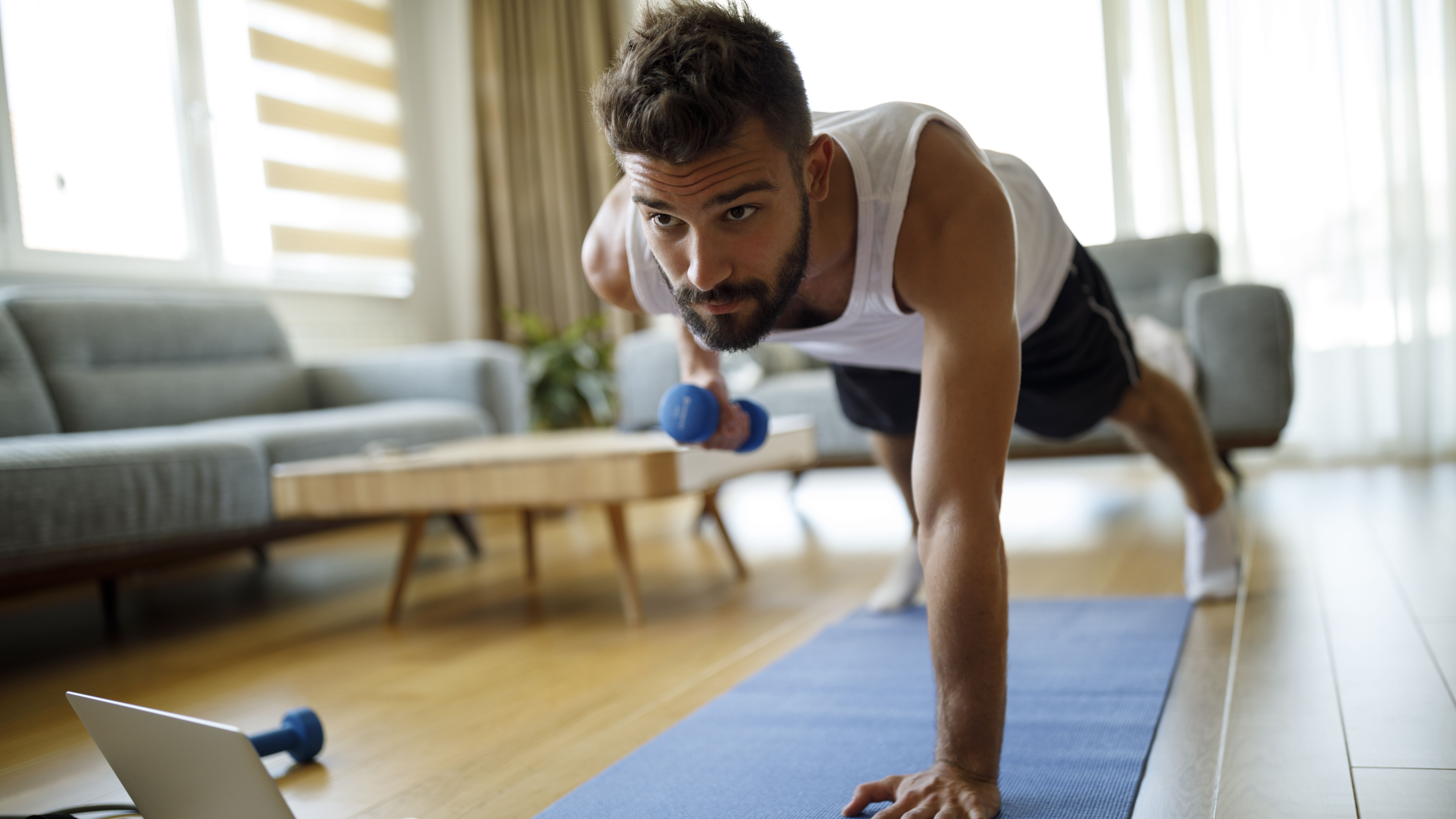 Man doing low-impact exercise at home
